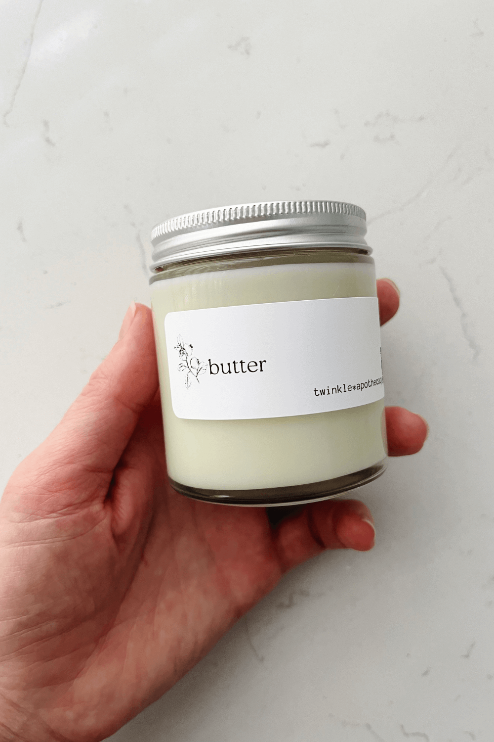 4 oz jar of twinkle apothecary natural butter moisturizer for face and body 