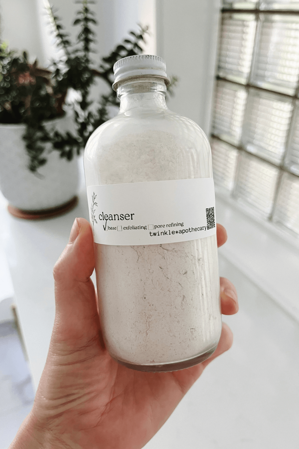 twinkle apothecary powder cleanser in a large glass bottle 