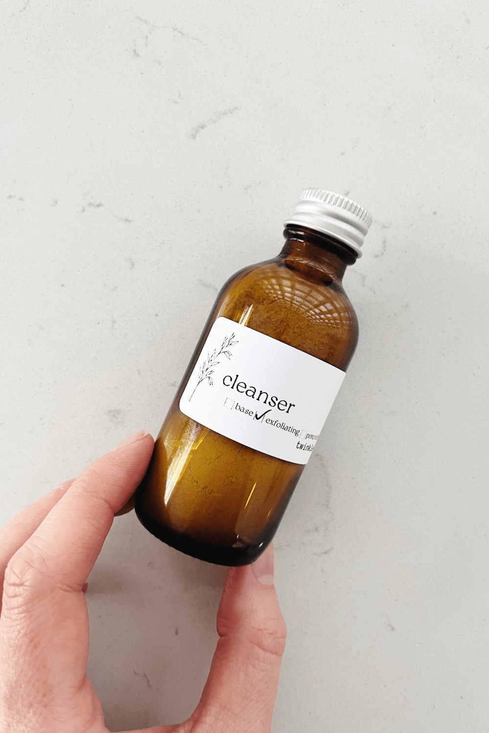 travel size bottle of twinkle apothecary cleanser 