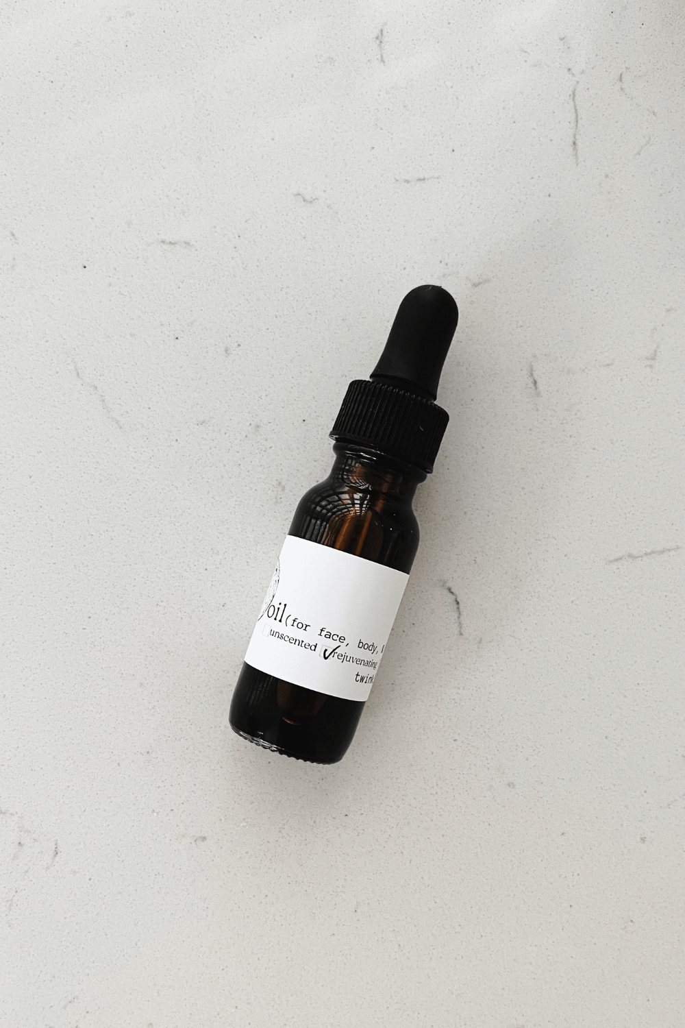 1/2 oz bottle of twinkle apothecary oil for face, body, and hair 