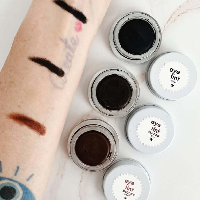 swatches of twinkle apothecary eye tint natural mascara and brow color 
